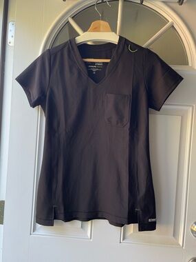 Grey's Anatomy women’s evolve stretch Black Scrub Top with green stitching XSM